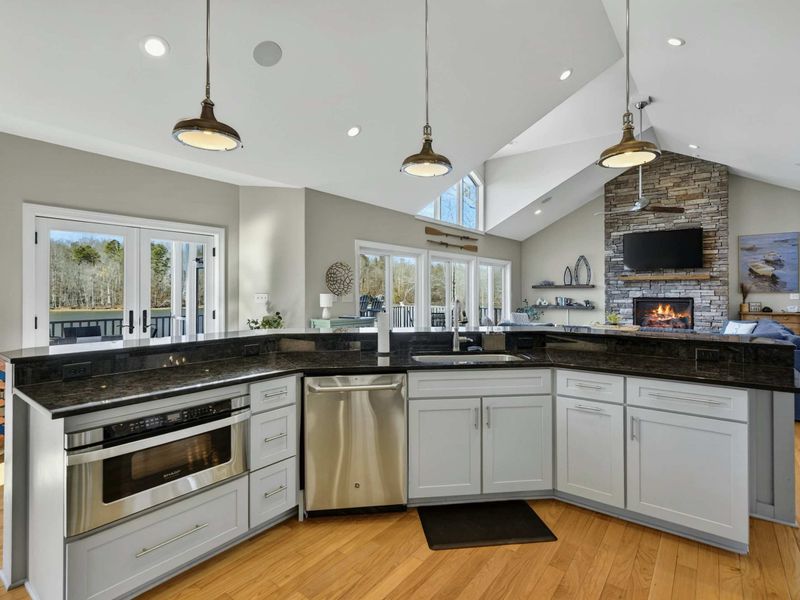 Kitchen - Wine rack, built-in microwave drawer, and ample prep space along the kitchen perimeter.