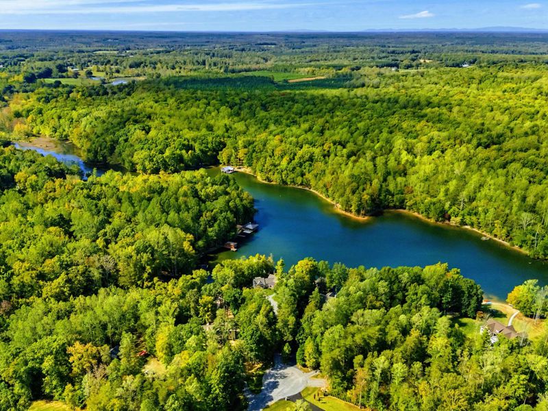 Aerial View - Panoramic perspective of the stunning Lake Anna cove and lush Virginia landscape.