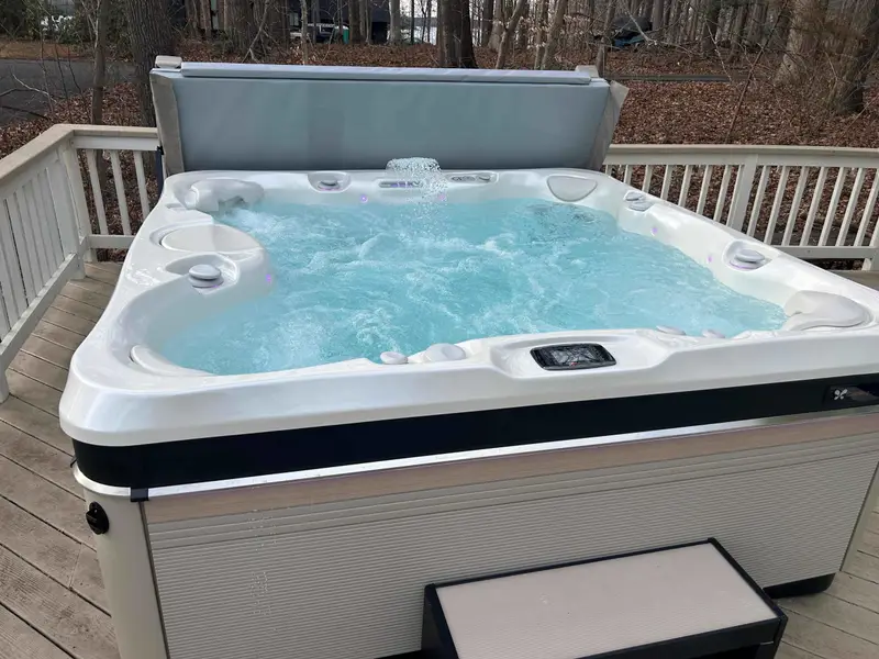 Enjoy a soak in the hot tub with lake views.