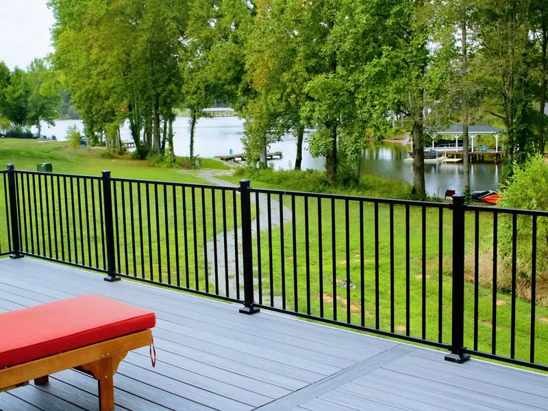 Upper Deck - Cushioned lounger on the composite deck invites you to soak in the lake views through the surrounding trees.