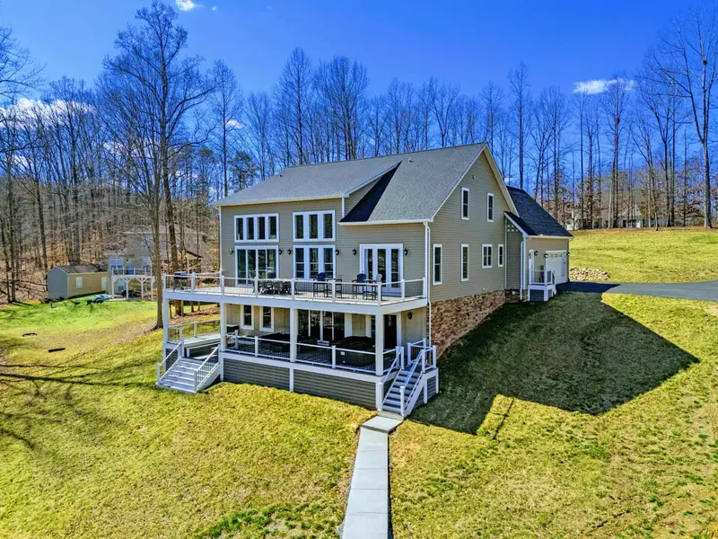 Drone View - The full scope of the property from above, dock to treeline.
