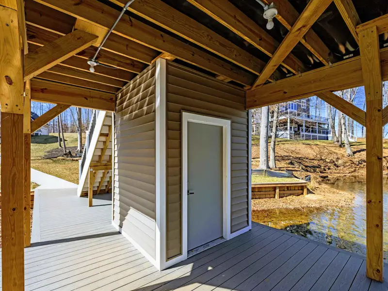 Dock Approach - The covered boat dock sits just off the backyard, ready for a day on the water.