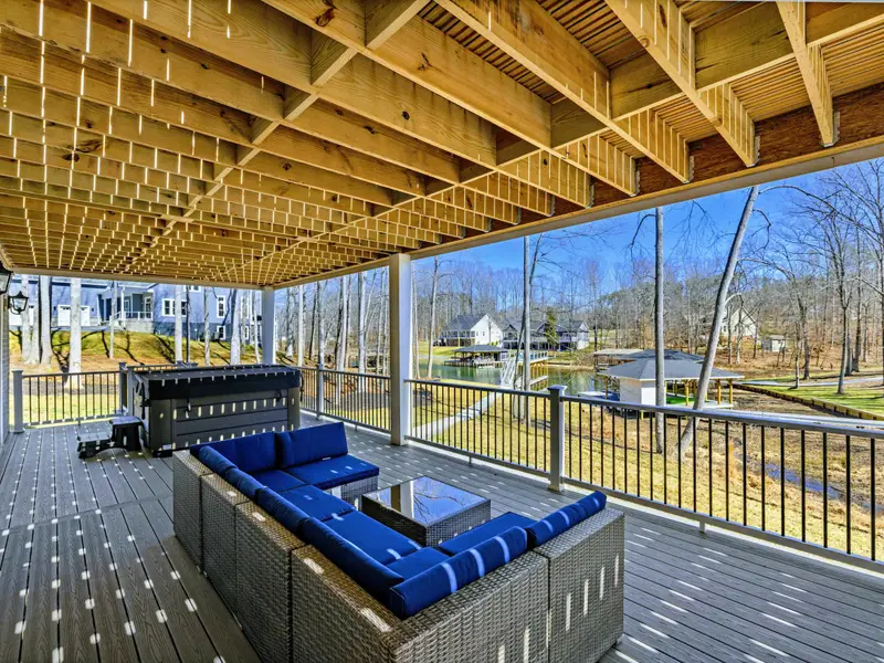 Covered Lounge - A blue sectional under the covered patio creates a second living room outdoors.