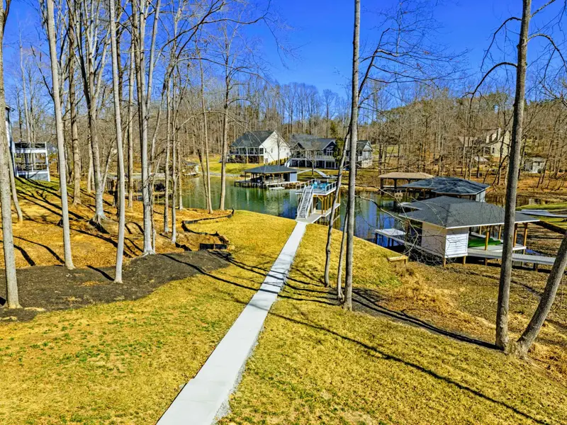 Backyard from Above - The flat, open yard and pathway to the dock, captured from overhead.