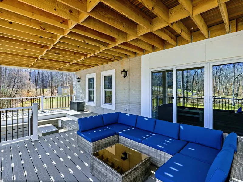 Outdoor Living - The covered patio blends comfort and views, with seating for the whole group.