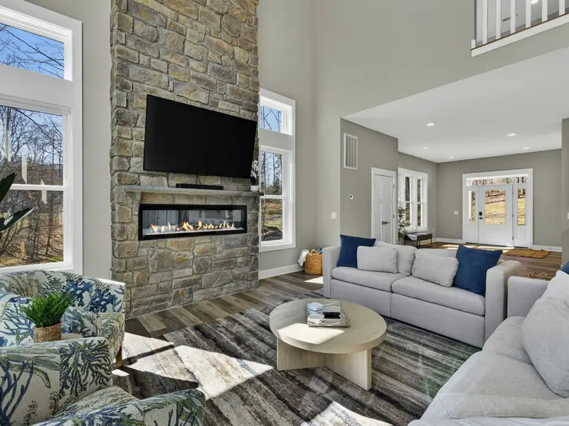 Gathering Place - The great room flows into the kitchen and deck, keeping everyone in the mix.