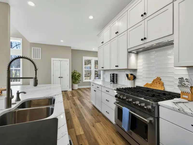 Kitchen Detail - Clean lines and quality finishes throughout, from the sink to the range.