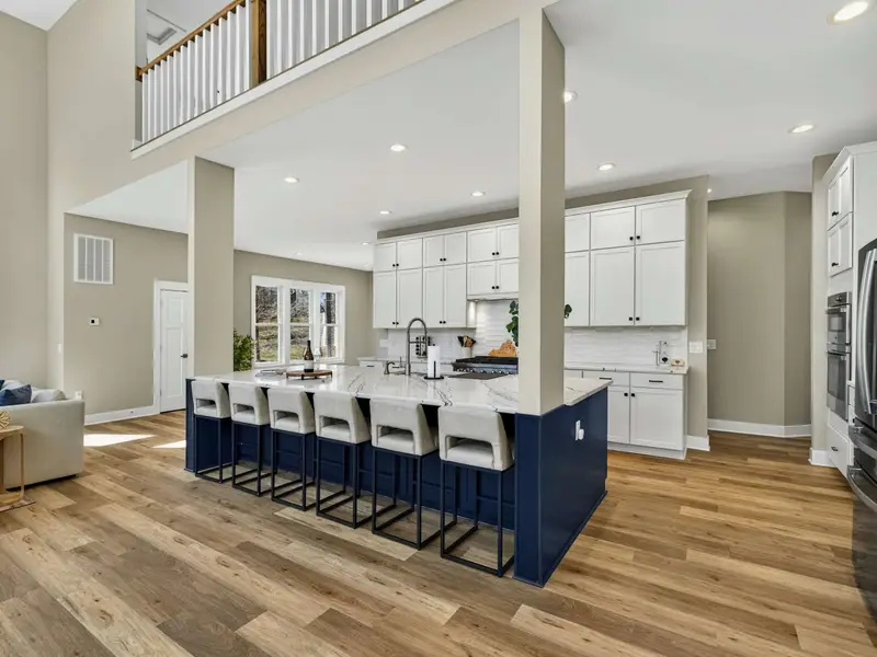 Breakfast Bar - Pull up a stool at the oversized island for casual meals with a view of the great room above.