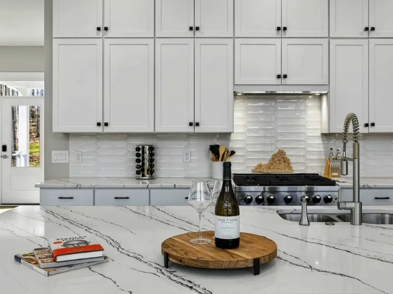 Countertop Styling - Quartz counters, a wine display, and room to prep make this kitchen built for entertaining.