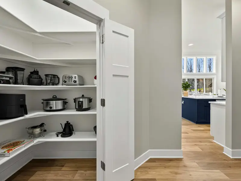 Walk-In Pantry - A generous pantry off the kitchen keeps everything organized and within reach.