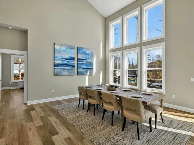 Dining Room - A long table under soaring ceilings and ocean-inspired art sets the scene for group meals.