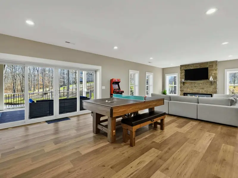 Lower Level Layout - The full game room in view: pool, shuffleboard, arcade, and bar all in one space.