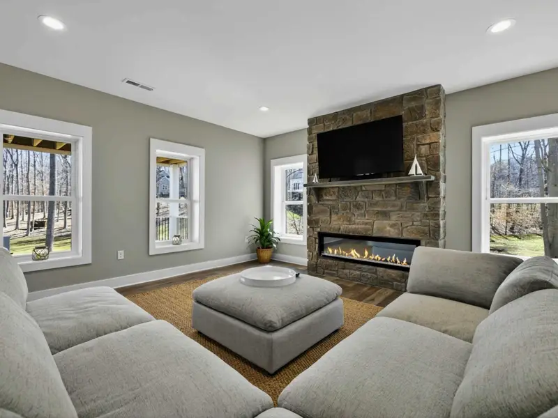 Fireside Lounge - A separate seating area with a stone fireplace gives the lower level a cozy gathering spot.