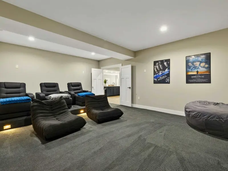 Theater Room - Leather recliners and oversized bean bag seating turn movie night into an event.
