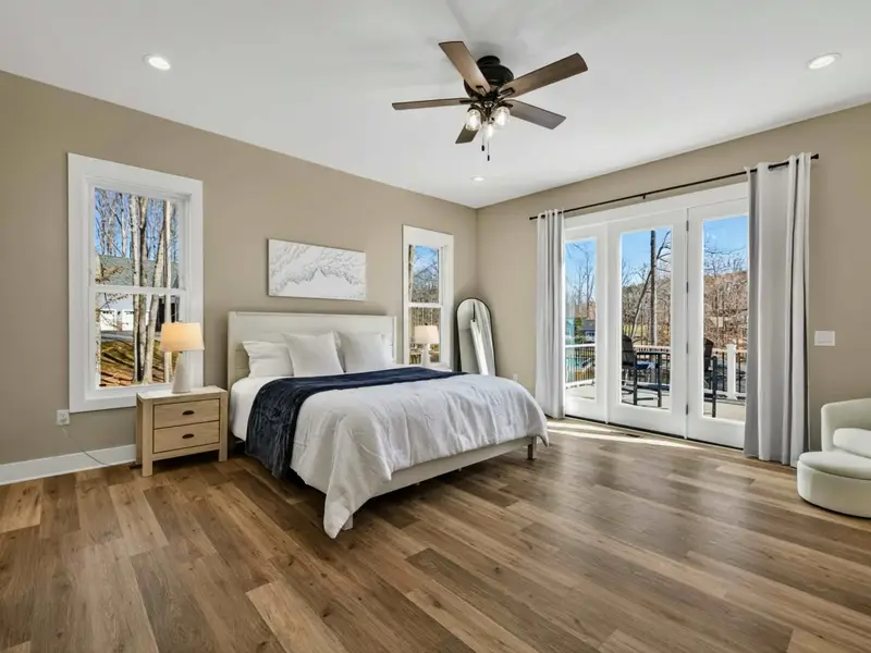 Primary Suite - A king bed, ceiling fan, and direct deck access make this the premier room in the house.