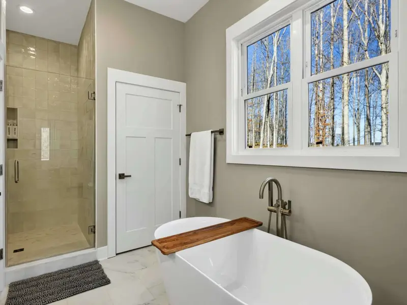 Tile Work - Handsome tile and quality finishes elevate the primary bath beyond the ordinary.