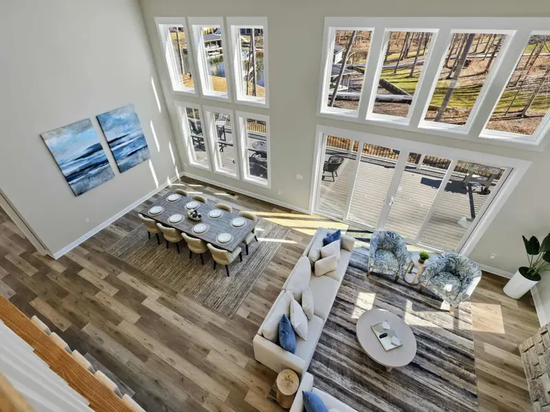 Loft Overlook - From the upper loft, the full scale of the great room and its lake-facing windows comes into view.
