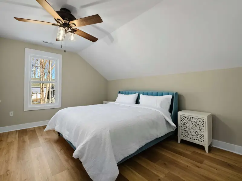 Cozy Quarters - Warm bedding and natural light make this upper room a comfortable home base.