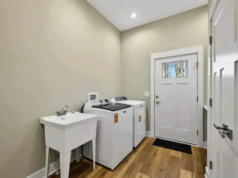 Laundry Room - Full-size washer and dryer with a door to the outside for easy access.