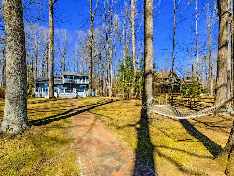 Brick Path - The walkway from the house to the lake passes the hammock, making it easy to pause and relax on the way to the water.