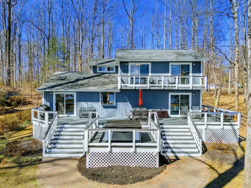 Deck Levels - The tiered deck design gives every level its own vantage point, from the upper balcony to the main deck to the hot tub platform below.