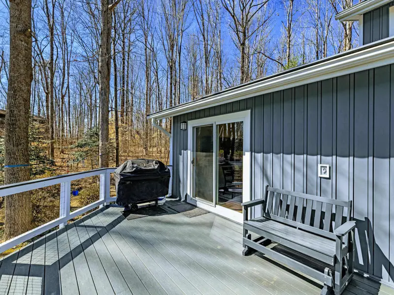 Grill Deck - A gas grill and bench seating on the side deck make outdoor cooking easy, with a sliding door right into the kitchen.