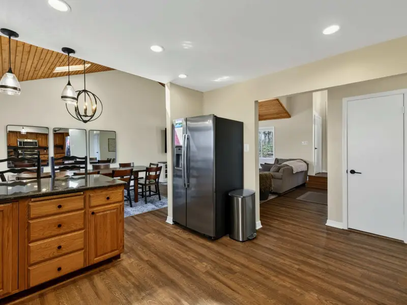 Kitchen Flow - The kitchen island opens to the dining area and living room, with the main-level bedroom just down the hall.