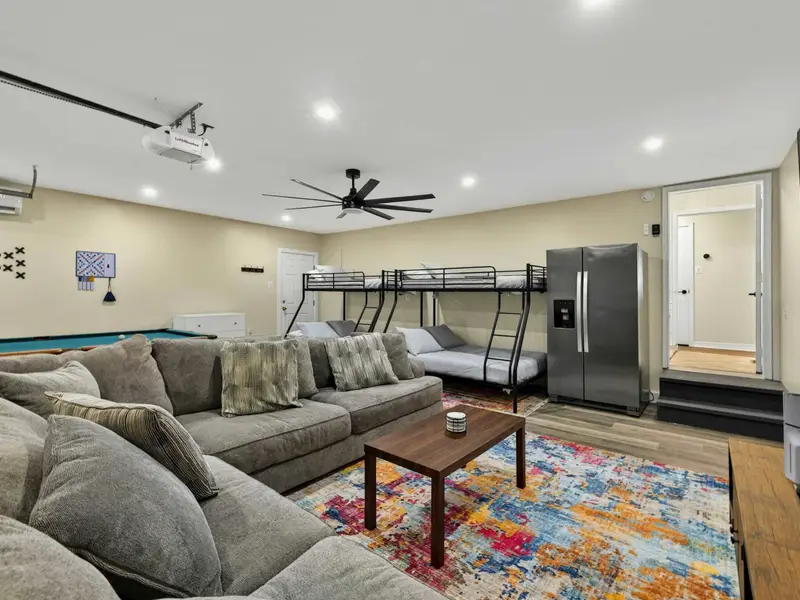 Game Room - The pool table, wall-mounted tic-tac-toe and Scrabble boards, twin-over-full bunk beds, and a full-size fridge make this room a self-contained hangout.
