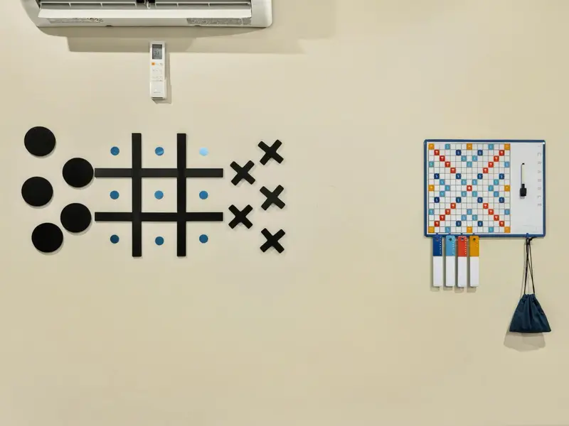 Wall Games - Oversized tic-tac-toe and a wall-mounted Scrabble board give the game room even more ways to play between pool and arcade rounds.
