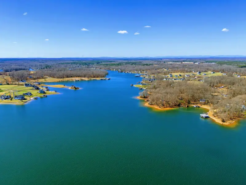 Lake Anna - Blue water stretches to the horizon with mountains in the distance, a reminder of how far the world feels from here.