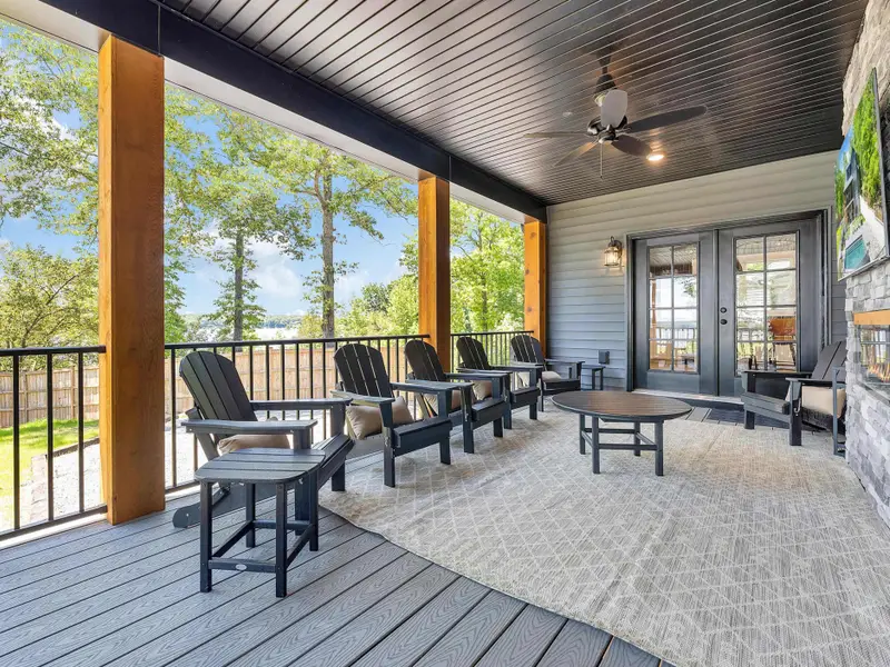 Main Level Covered Porch with Fireplace and TV