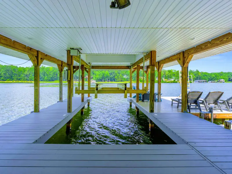 Aerial view of the private dock, covered pavilion, and waterfront. This is what Lake Anna living looks like.