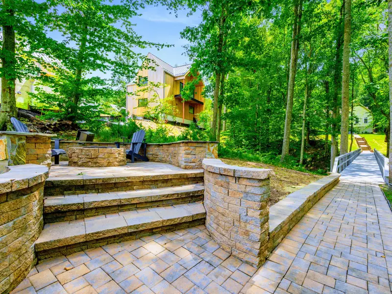 The path from the fire pit down to the dock and water. The whole backyard flows together naturally.