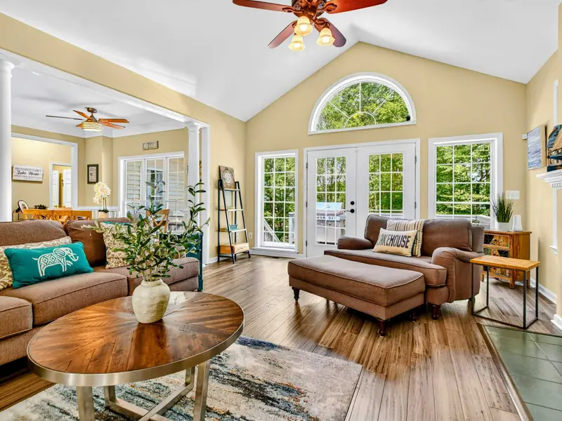 Hardwood floors, a stone fireplace, and room for everyone. The great room is where the trip comes together.