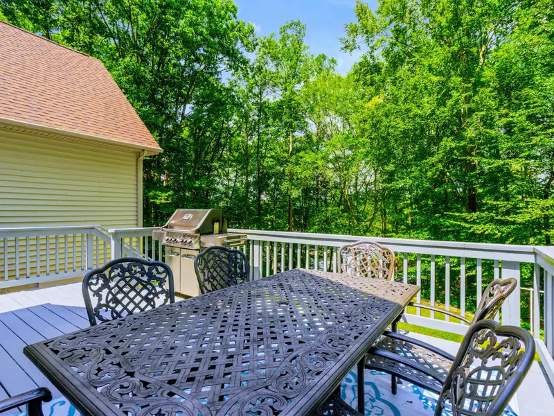 The upper deck dining area catches the evening breeze and keeps the whole group together for meals outside.