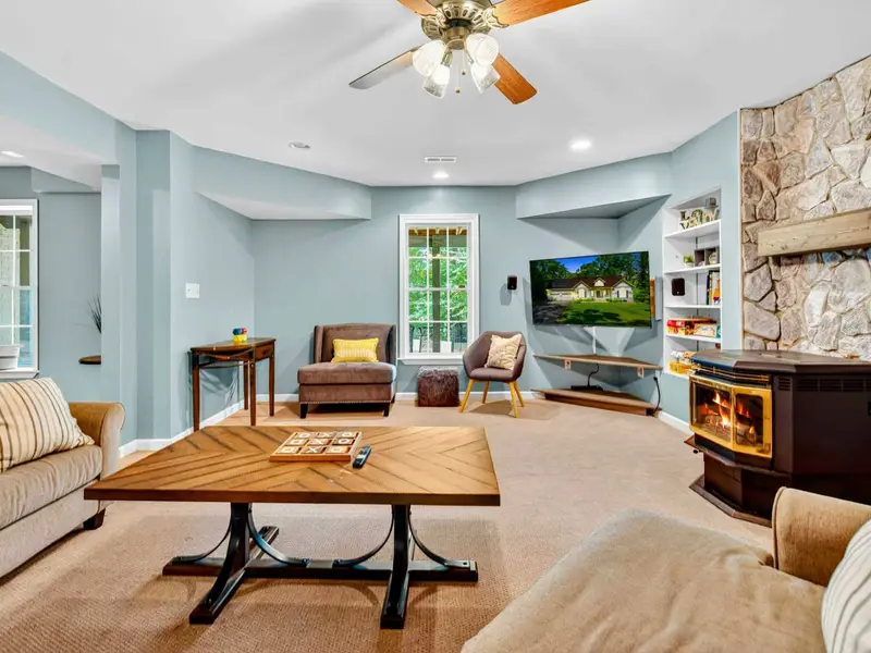 Plush sectional with throw pillows in the lower level lounge. Comfortable enough to lose a whole afternoon.