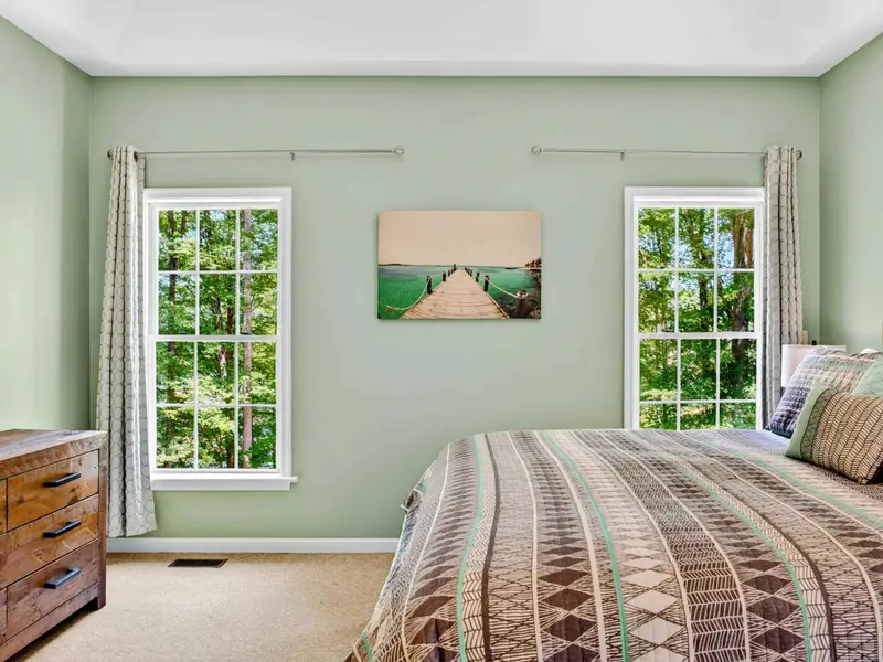 Spacious and sun-filled on the main level. The primary suite feels like a retreat within the retreat.