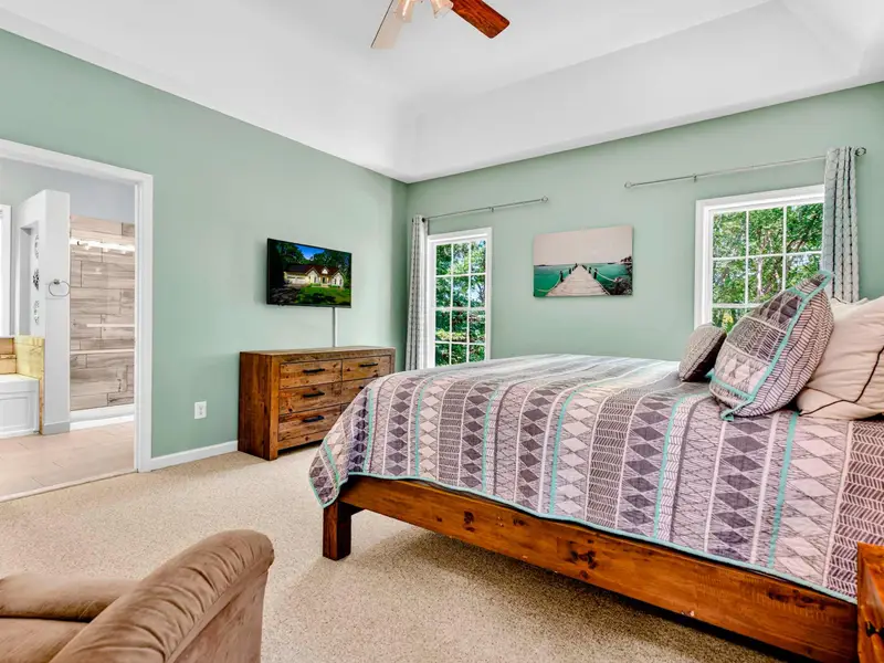 Plantation shutters let in just the right amount of light. Sleep in, or watch the trees sway before getting up.