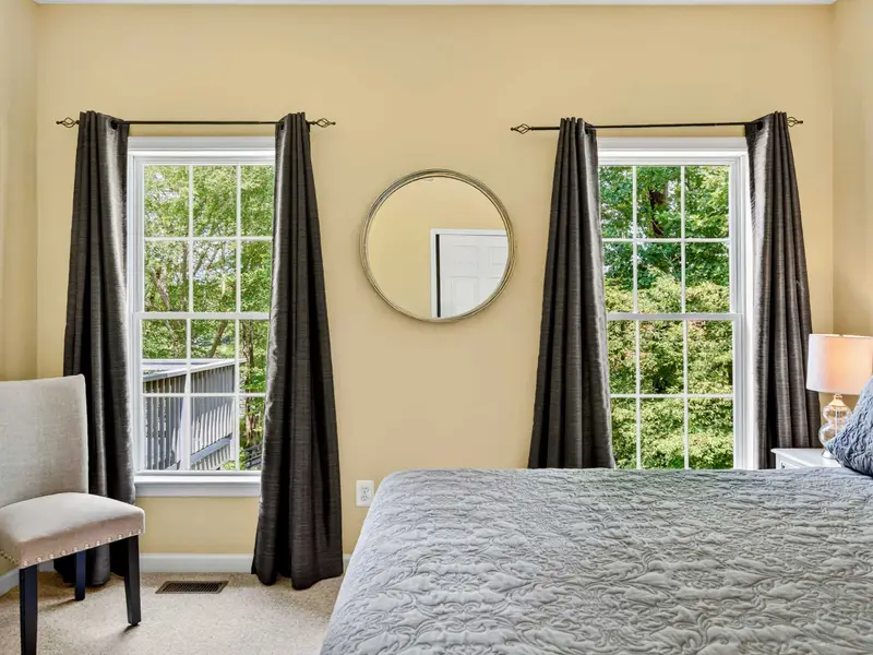 Natural light and dark curtains give this main level guest room the flexibility to sleep late or rise early.