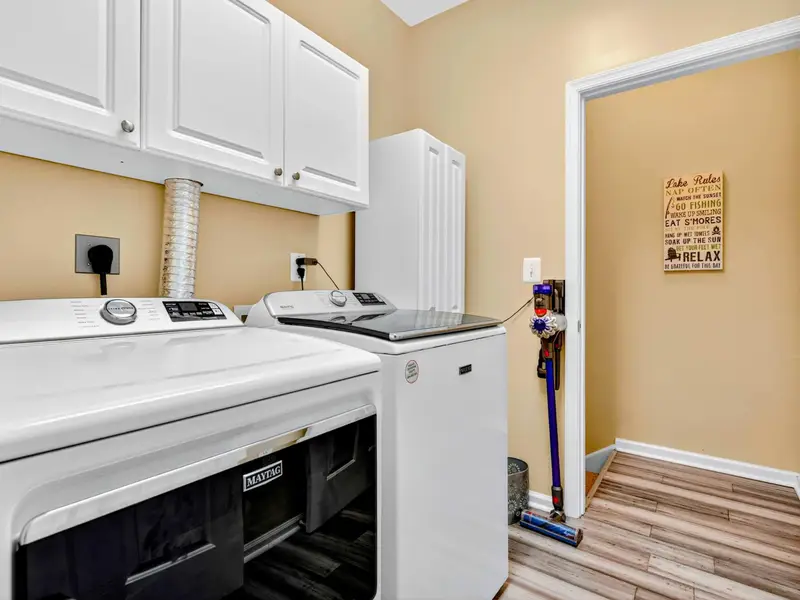 Full-size washer and dryer with storage. Pack light, the laundry room has you covered.