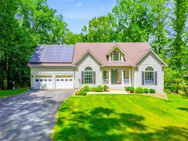 Three-car garage and landscaped approach. Plenty of space for gear, boats on trailers, and everything you brought.