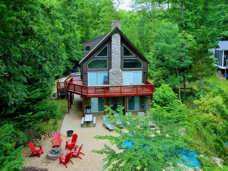 A Place Apart - Surrounded by trees and steps from the water, the property feels like its own private world.