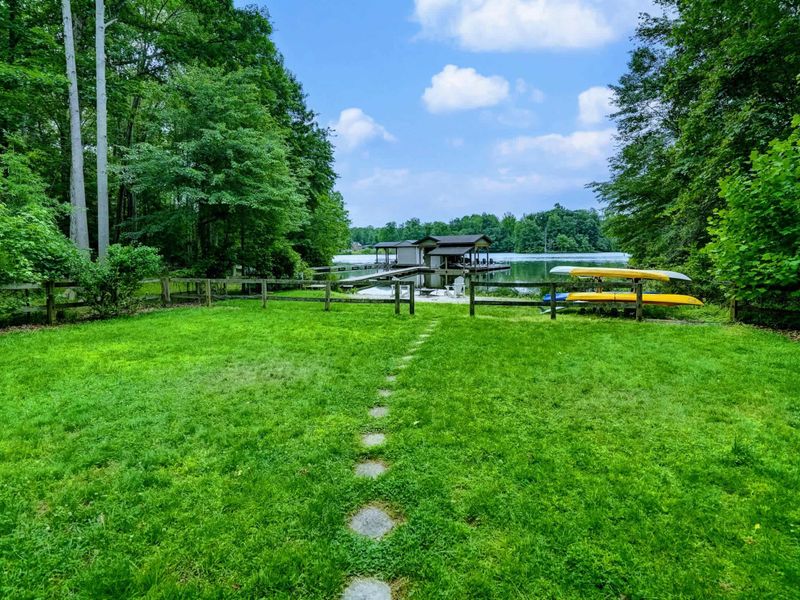 Lake Life, Uninterrupted - Wide open backyard views stretch down to the private dock and calm lake waters.