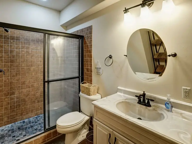 Clean and Complete - The lower-level full bath is well-appointed and steps away for easy private access.
