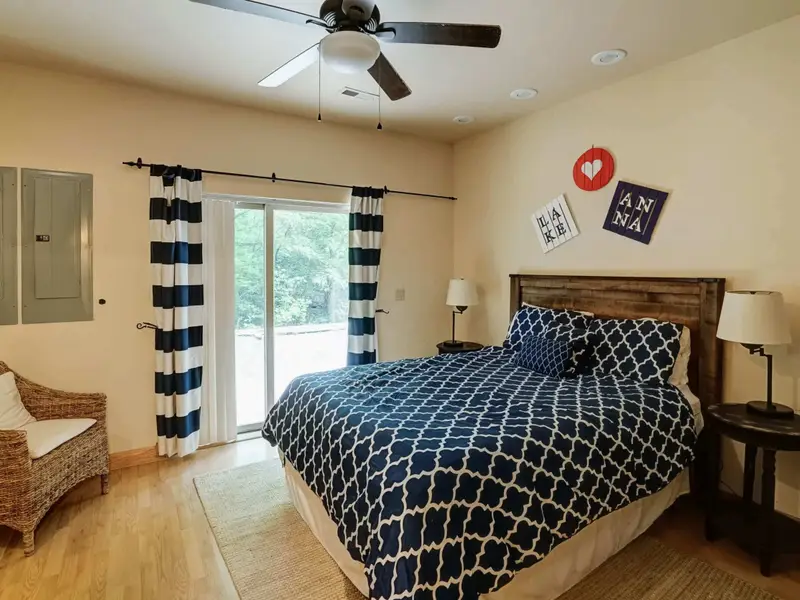 A Quiet Corner - The lower-level bedroom is a peaceful, private retreat away from the main living areas.