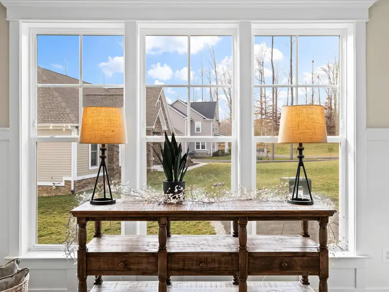 Foyer - Natural light pours in through the front sidelights, with the lake view visible straight ahead.