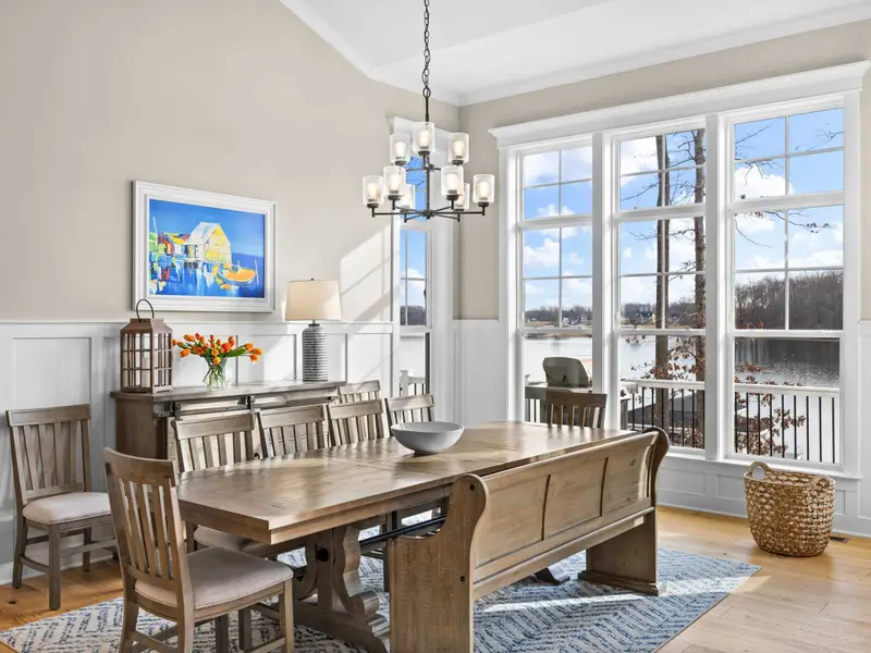 Dining Room - The dining area with bench seating and large lake-view windows sits just off the kitchen.