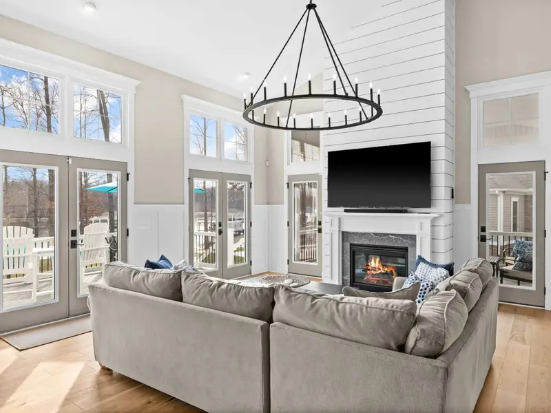 Great Room - Fire in the hearth and the lake beyond the doors, the great room is designed for long evenings with good company.