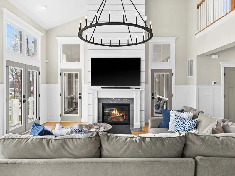 Great Room - Fireplace lit and French doors open, the great room blurs the line between inside and out.