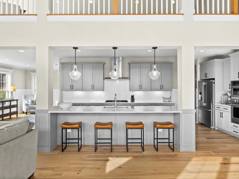 Kitchen - The kitchen bar faces the great room with the loft overhead, keeping the cook part of the conversation.